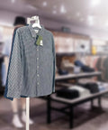 Adjustable White Costume Stand With A Single Arm Clothes Rack For Retail Display Of Garments In Thrift Shops Boutiques And Stores Height From 48 To 72 Inches For Flexible Eye Catching Showcases with checkered shirt on display