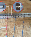 36 Inch Trailer Track Tie Down System With E Track S Track And L Track Anchors mounted on a wooden wall holding straps