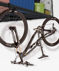 4 Pack Add On Storage Rail Hook Accessory For Ceiling Rack And Wall Shelving Systems holding a bike under a wire shelf