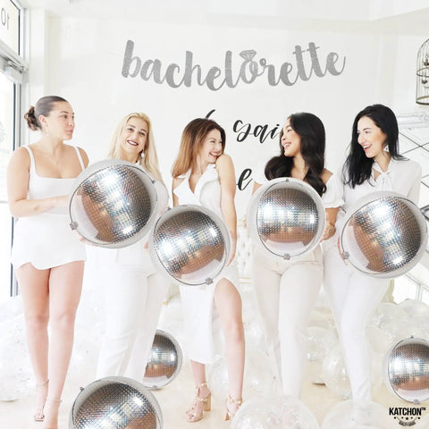 Group at bachelorette party holding 22 Inch Large Silver Disco Ball Foil Balloons Pack Of 6, Metallic Mylar Round Mirrors.