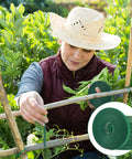 Person using Reusable Green Plant Tape For Climbing Plants, 6 Rolls, 196 Ft Total, Adjustable Soft Garden Ties outdoors in garden.