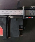 Close-up of 4-pin electromagnetic pushbutton switch being measured, part of the Electromagnetic Pushbutton Switch Set, 2 pack.