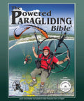 Cover of 'The Powered Paragliding Bible 5', featuring a paraglider in flight over a coastline, with clear skies and scenic views.