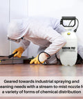 Person using 1.5 Gallon Bleach Sprayer With Durable Viton Seals For Home And Yard Cleaning, wearing protective gear indoors.