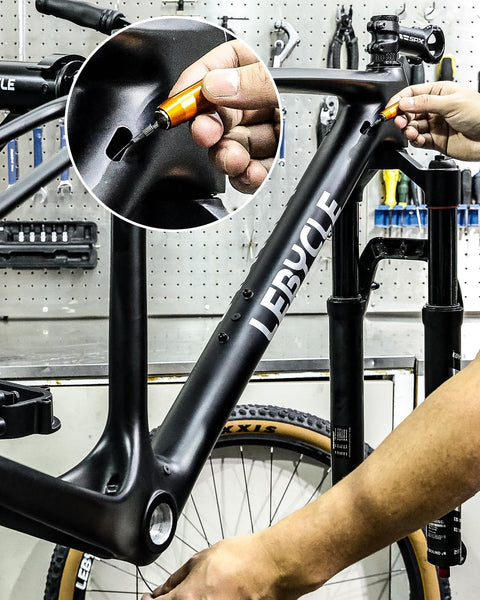 LEBYCLE internal cable routing kit orange tool guiding brake/shifter/Di2 cables through bike frame (side view)