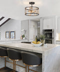 2 Light Modern Semi Flush Mount Ceiling Light With Clear Glass Shade in a sleek kitchen with a marble island and black chairs.