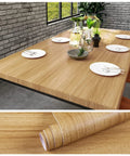 Natural Brown Wood Contact Paper Peel And Stick For Cabinets, Countertops, And Furniture, Waterproof Woodgrain Wallpaper Self Adhesive Removable 15.7x118 Inch Roll on table and roll display