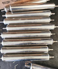 Dope Galvanized Steel Roller Set 10 Pcs Replacement Conveyor Belts For Woodworking Tables Smooth Glide Heavy Duty Support Dia 1.5 Inch Long Length, stainless steel rollers arranged on a surface.