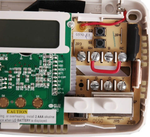 Internal view of Simple 5 2 Day Battery Powered Digital Thermostat For Single Stage Heating Cooling And Heat Pump Systems with circuit board.