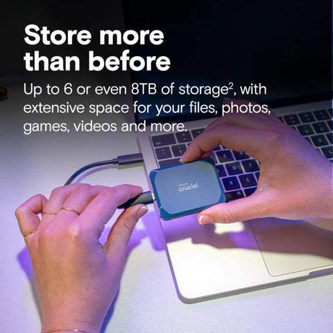 Hands connecting X10 4TB Portable SSD With Up To 2100 MBps Read Speeds USB 3.2 Gen 2 Type C External Solid State Drive to laptop