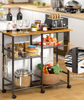 Must-Have Rolling Kitchen Microwave Cart With 3 Tier Shelves, Adjustable Shelf, Lockable Wheels holding kitchen items