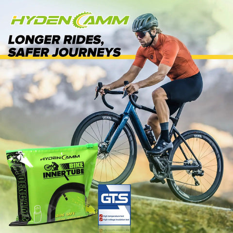Cyclist riding on road with Hyden Camm 26 Inch Bike Inner Tube 4 Pack Fits 26 x 1.75 2.125 in foreground for road rides