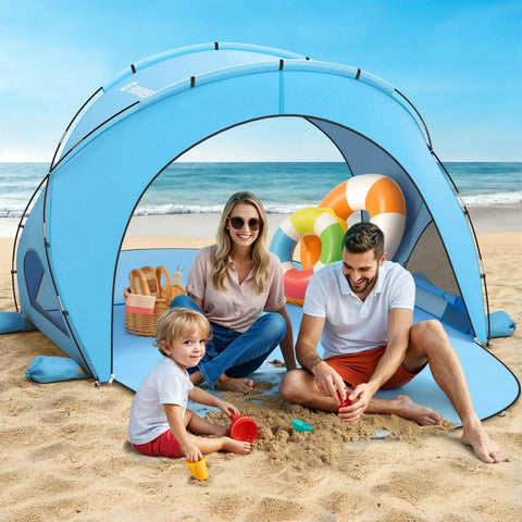 Family enjoying under Beach Shade Tent With UPF50 UV Protection, Portable Sun Shelter For 1 To 3 People, Easy Setup Beach Tent, Blue