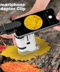 Smartphone clipped to 100x To 250x Portable Pocket Microscope For Kids And Adults Handheld Mini Microscope Kit magnifying a leaf.