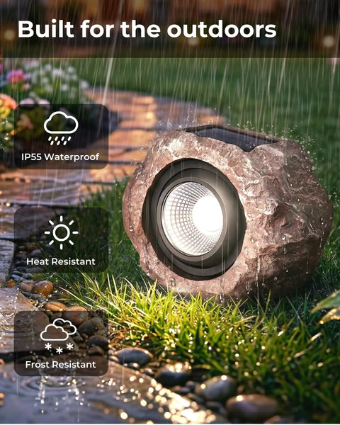 Two Pack Solar Rock Lights Outdoor Adjustable Angle Waterproof LED Garden Pathway Lights in stone design under rain