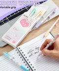 DIY Gel Pens With Cute Stickers Six Pack 0.7mm Black Ink Smooth Writing Quick Dry Journaling Pens alongside a notebook and laptop