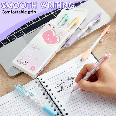DIY Gel Pens With Cute Stickers Six Pack 0.7mm Black Ink Smooth Writing Quick Dry Journaling Pens alongside a notebook and laptop