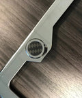 Slick Chrome License Plate Frame Screw Cover Caps With Hidden Bolt Design featuring carbon fiber pattern and aluminum material.