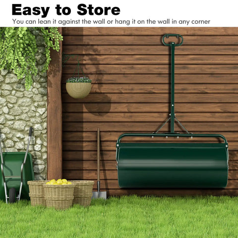 Beast Of A Lawn Roller For Yard And Garden Push Or Tow Behind 30 Gallon Water Sand Filled Sod Roller Drum resting against a shed