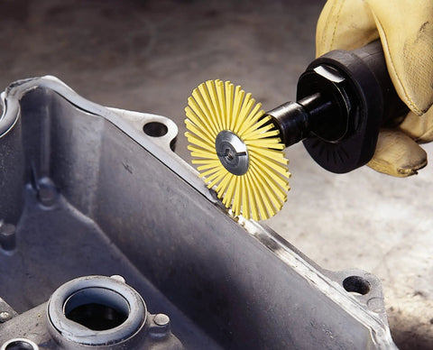 Cubitron Radial Bristle Brush With Ceramic Abrasive Grain for Finishing Polishing and Deburring, applied to metal surface