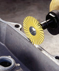 Beefy Radial Bristle Brush with Aluminum Oxide Abrasive for Rotary Tools in use, cleaning metal surface, industrial application