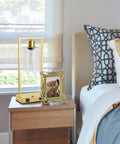 Industrial Table Lamp Set Of 2 With Gold Finish, Dimmable Nightstand Lamps, USB Ports And AC Outlet, Clear Glass Shade, LED Bulbs Included, Perfect For Bedroom Or Living Room Vibe, Sturdy Rectangular Base on a nightstand.