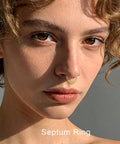 Close-up of woman wearing 16G Teardrop Septum Ring With V-Shaped Openwork Bar And CZ Stones, 316L Surgical Steel Hinged Clicker