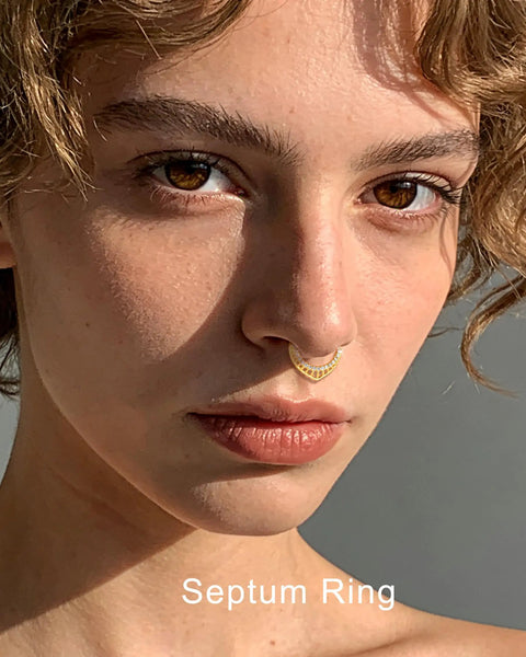 Close-up of woman wearing 16G Teardrop Septum Ring With V-Shaped Openwork Bar And CZ Stones, 316L Surgical Steel Hinged Clicker