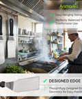 Stainless Steel Griddle Spatula Set of 3 With Scraper Heavy Duty Spatulas hanging in professional kitchen next to grill.