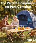 Two Person Camping Tent With Quick Setup In Minutes Waterproof With Mesh Top And Ventilated Door next to couple in park