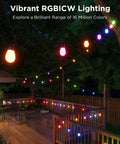 Lit Outdoor String Lights 96ft Dual Rope RGBIC LED Bulbs With 111 Scene Modes illuminate a vibrant patio with wooden deck and chairs.