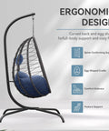 Foldable Egg Chair With Stand For Indoor And Outdoor Use Wicker Rattan Swing Chair 485 Lbs Capacity Strong Iron Frame UV Resistant Cushion Patio Balcony Blue shown from the side