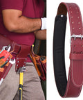 Heavy Duty Leather Work Belt With Padded Mesh Comfort And Adjustable Fit Two Point Five Inch Wide Tool Belt For Carpenters Electricians Framers And Mechanics Suspender Ready With Pouches Maroon, shown on a person with tools.