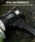 Rechargeable Spotlight 2,000,000 Lumens Handheld LED Flashlight wet on ground showcasing waterproof feature