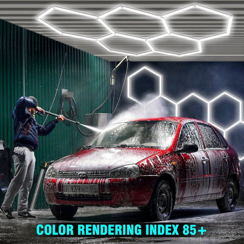 Person washing car under Hexagon LED Garage Lights Kit With 456W Output And 6500K Daylight, 14 hex panels overhead