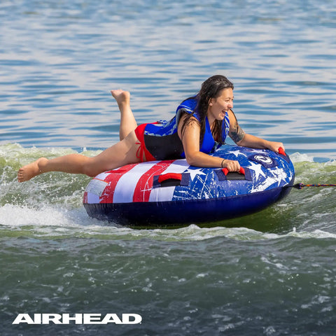 Airhead Stars And Stripes Towable Tube For 1 Rider Boating And Water Sports Made In The USA Heavy Duty Full Nylon Cover Patented Speed Safety Valve For Easy Inflation And Deflation Foam Padded Handles, rider on tube