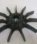 Plastic impeller fan with multiple blades, viewed from top angle, showing central hub and blade design details.