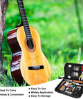 79 Piece Guitar Maintenance Kit with All In One Setup and Repair Tools displayed near acoustic guitar outdoors