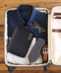 Waterproof Double Layer Electronics Organizer Bag for Cables Chargers Power Banks Adapters USB Cables Kindle Hard Drives And More Portable Travel Case On The Go with Adjustable Dividers inside a packed suitcase