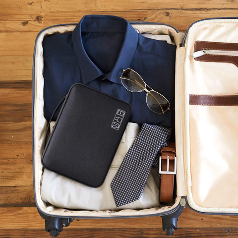 Waterproof Double Layer Electronics Organizer Bag for Cables Chargers Power Banks Adapters USB Cables Kindle Hard Drives And More Portable Travel Case On The Go with Adjustable Dividers inside a packed suitcase