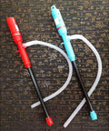 Portable Electric Transfer Pump DC12V Handheld Fuel Pump For Gasoline And Light Oils Vehicle Mounted Siphon Style With Hose ABS Compact Design For Outdoor Use Workhorse Delivers Seven To Eight Liters Per Minute Flow For Fast Liquid Transfers. red and blue handheld pumps with hose on patterned background