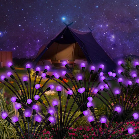 Purple Firefly Solar Lights Outdoor 2 Pack With 16 LEDs Waterproof Starburst Swaying Garden Path Lights illuminating a garden at night