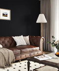 Living room with Matte Black Peel And Stick Wallpaper Self Adhesive Waterproof Countertop Paper For Cabinets And Walls Thick Renter Friendly Cover Sticks Easy With Knife And Rag 15.8 x 196 Inches (21.5 Sq Ft) For Kitchen Bedroom Living Room Camper behind a brown leather sofa