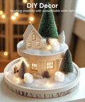 Decorative Christmas scene arrangement with mini house, pine trees, and warm Flameless Tealight Candles With Remote Timer Battery Operated 12 Pack Warm White