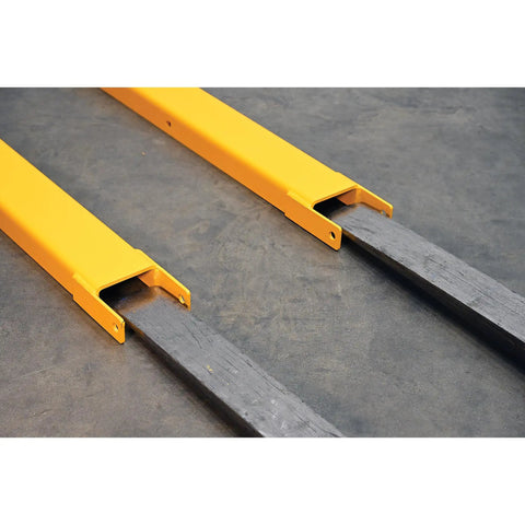 Heavy Duty Pin Lock Forklift Extensions Boss Level Steel Bars 4000 Lb Capacity No Sweat Mounting, Yellow rig attachment on floor.