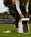Golfer using Approach R50 Golf Launch Monitor And Simulator Bundle With Three Camera Precision Built In Ten Inch Color Touchscreen