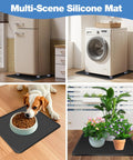 Mini Fridge Silicone Mat With Four Base Risers 24 By 24 By 0.8 Inches Drip Tray Under Refrigerator Mat Floor Protector Leak Resistant Portable Durable Anti Slip Black shown with fridge, washer, pet dish, plants