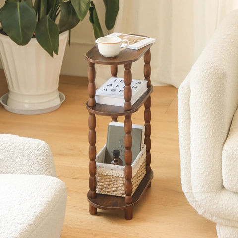 Three Tier Narrow Side Table With Storage For Small Spaces shown with books and a cup in a living room setting.