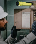 Worker using Dualie 275 Lumen Multi Function Intrinsically Safe Rechargeable Flashlight With Magnetic Clip on control panel