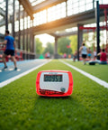 Mini Portable Pedometer With LCD Screen, Dope Step Counter For Walking Or Running, Tracks Distance In Miles, Calories Burned, Exercise Time, And Daily Goal Monitor, Lightweight Red Fitness Gadget on grass